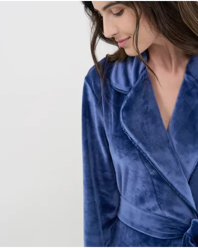 Long navy velvet robe for women, crossover design with elegant tuxedo collar and belt.