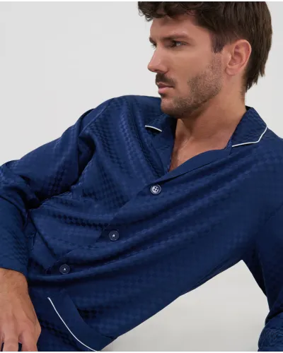 Front view of men's navy blue jacquard checked winter pyjamas, with button-front and patch pockets.