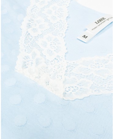 Detail of short winter nightdress with long sleeves and lace at the neckline