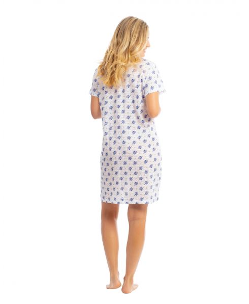 Young girl in cool summer nightgown in cotton with blue flowers print