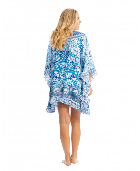 Woman wears short kaftan with 3/4 sleeves and blue print with detailing