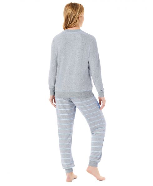Rear view of woman in long-sleeved pyjamas with long striped trousers