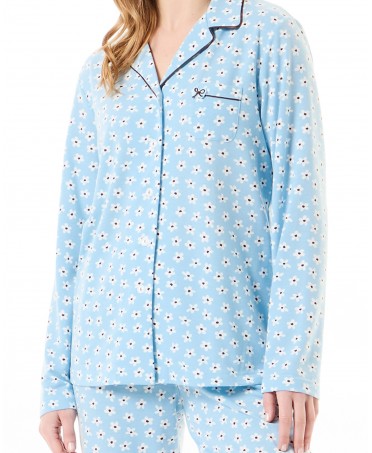 Detail of women's winter pyjama jacket open with light blue daisies print