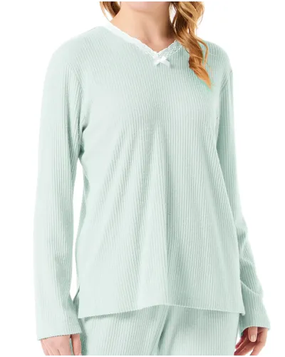 Woman in lingerie pyjamas with long sleeves in soft green with lace detail