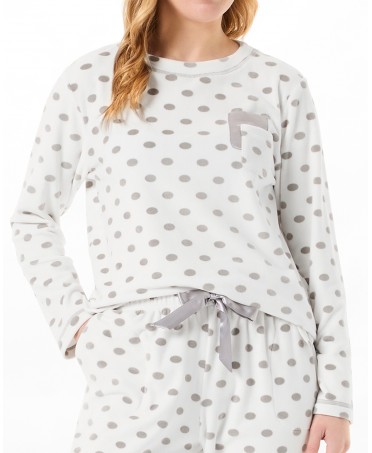 Detail of long sleeved velvet pajama jacket with polka dots