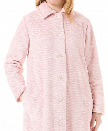 Detail view of an open winter dressing gown with buttons in pink herringbone fabric