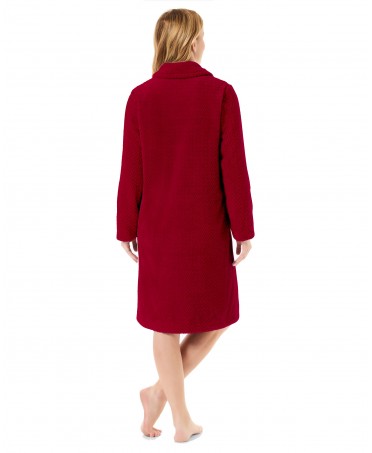 Rear view with burgundy long winter coat in herringbone weave with side pockets.