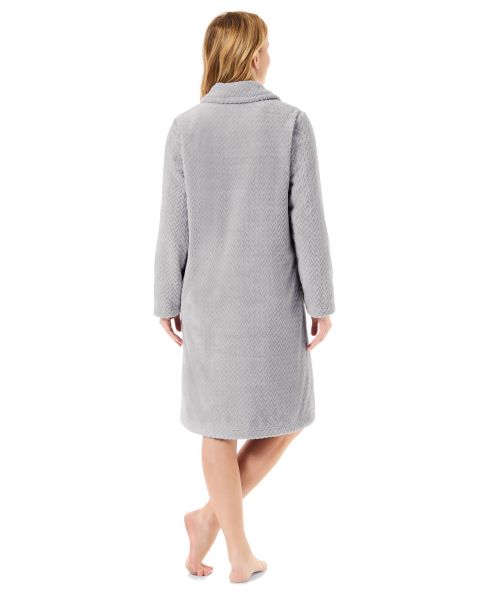 Rear view with herringbone grey long winter coat with side pockets.