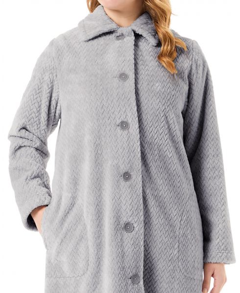 Detail view of a grey buttoned women's long coat