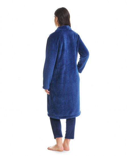 Rear view of a woman in a long, blue, vigorous dressing gown