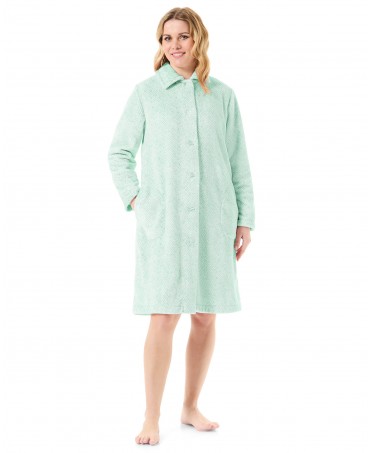 Woman in green herringbone woven long dressing gown with buttons and pockets
