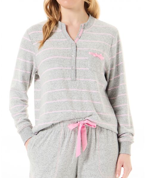 Detail view of pyjama jacket with long sleeves and open button-down collar with pink stripes and satin detailing