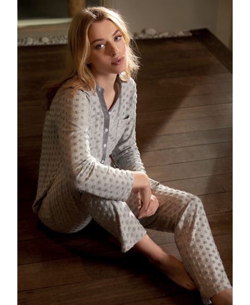Woman in long knitted polka dot pyjamas