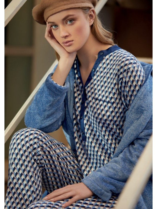 Seated woman in elegant long pyjamas with diamonds