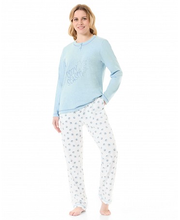 Woman in light blue winter pyjama jacket with embroidery and plain trousers with leaf print