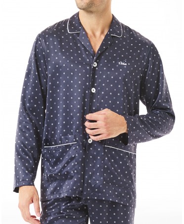 Detail view of men's pyjama jacket open with buttons, piping, front pockets blue polka dots