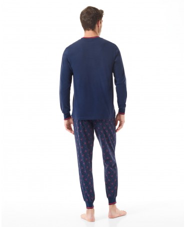 Rear view of men's blue Christmas pyjamas with red Christmas motifs. Trousers with pockets and lacing.
