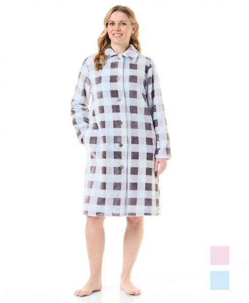 Woman in light blue plaid buttoned long winter coat with pockets
