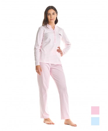 Woman in long winter pyjamas, long-sleeved striped pink printed jacket, V-neck with buttons, plain long trousers.