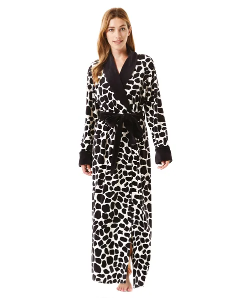 Woman in animal print velvet Christmas long dressing gown with contrast collar, cuffs and belt