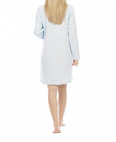 Woman in blue winter nightgown with polka dot pattern