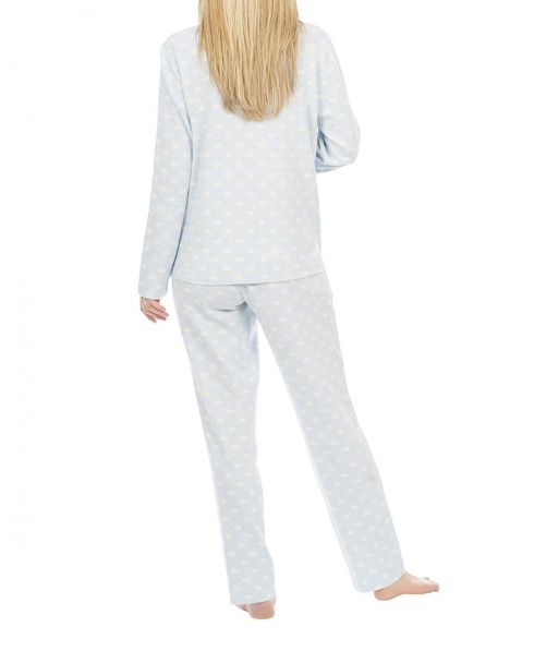 Woman in long winter pyjamas with polka dot pattern