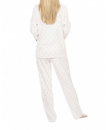 Woman in long pyjamas with silver polka dots winter pyjamas
