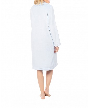 Woman in blue long-sleeved winter dressing gown with zip fastening
