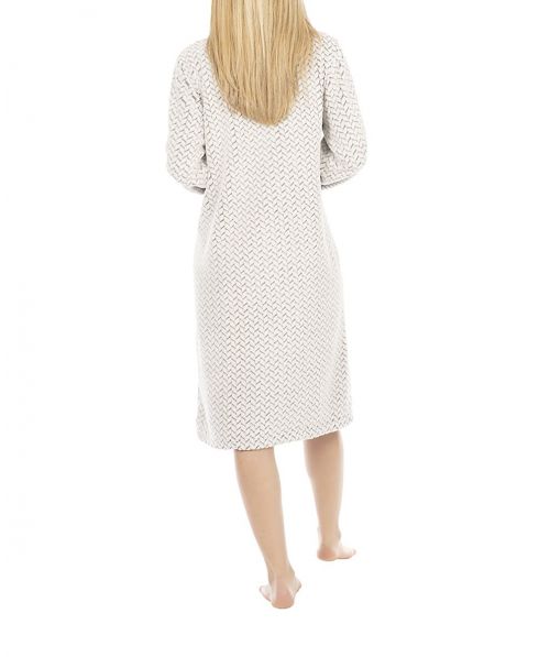Woman in zigzag patterned long buttoned dressing gown