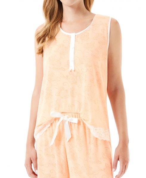 Orange pyjama detail with sleeveless top with lace, buttons and shorts with bow.