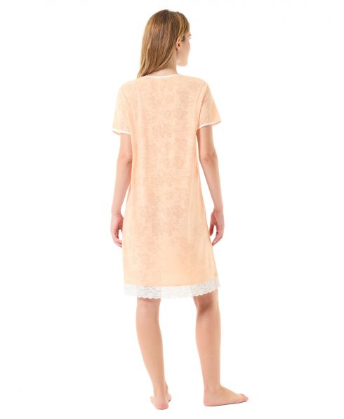 Rear view of a woman wearing a short summer nightgown with orange lace trimming