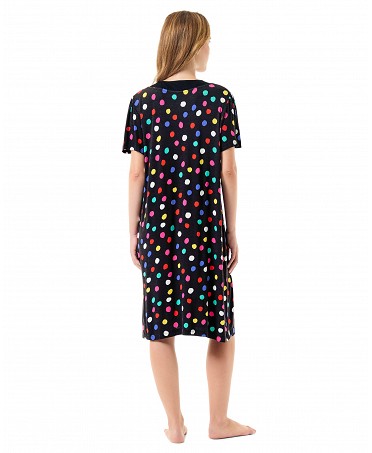Woman with back in short multicoloured polka dot summer dress with short sleeves