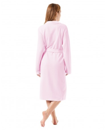 Rear view of a woman wearing a pink knitted housecoat.