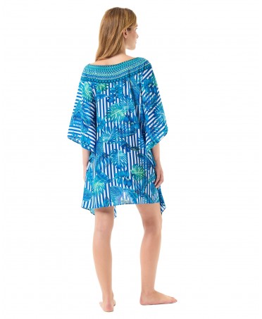 Rear view of a woman wearing a short blue and white striped summer kaftan.