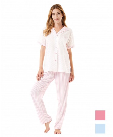 A woman wears an open summer pyjama set in pink and white striped plumeti.