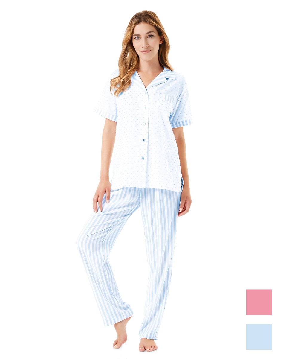 A woman wears open summer pyjamas with blue and white striped plumeti buttons.