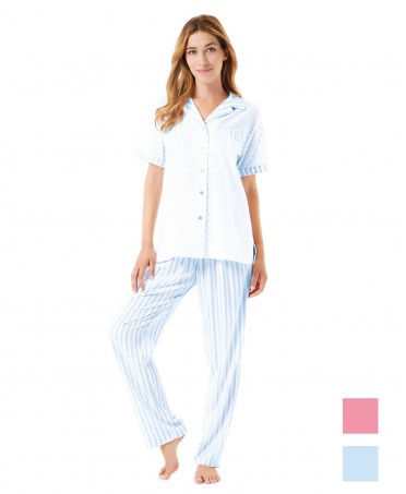 A woman wears open summer pyjamas with blue and white striped plumeti buttons.