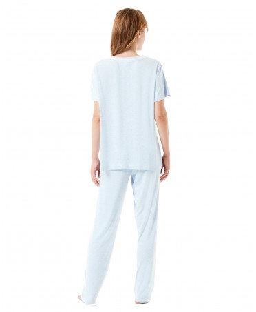 Rear view of woman in light blue short sleeved pajamas for summer