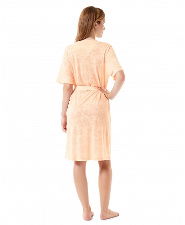 Back view of a woman in a short orange summer dressing gown