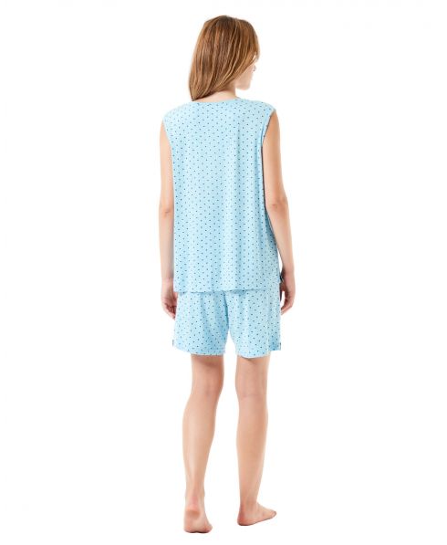Back view of a woman in summer sleeveless pyjamas and turquoise shorts