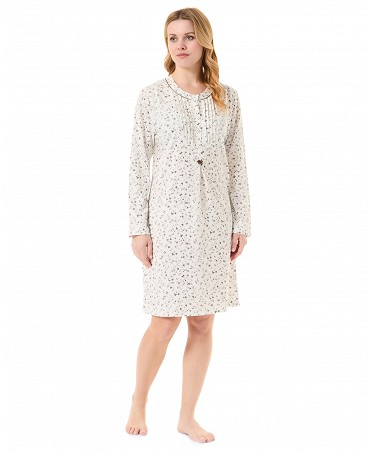 Woman with long winter nightdress, floral print, round neck with buttons.