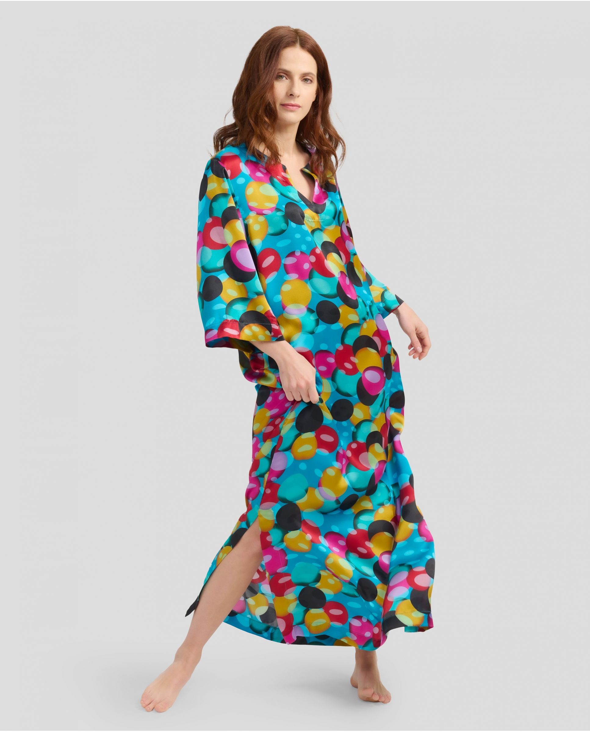 Woman with long summer kaftan in natural printed silk