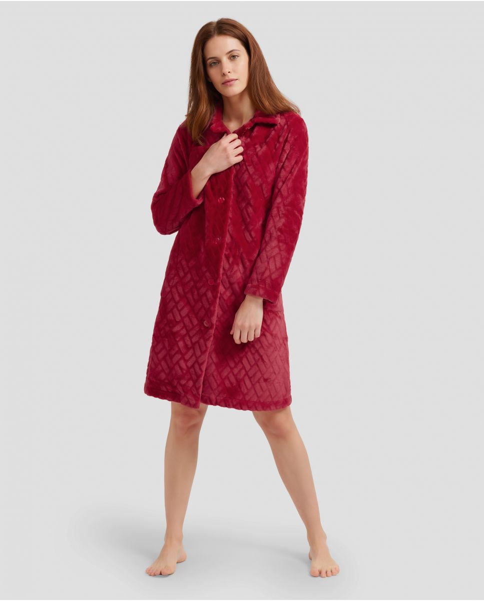 Woman in burgundy long dressing gown with buttons