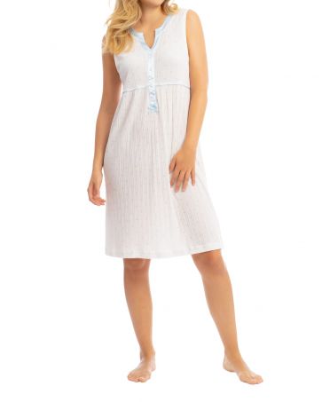Woman in sleeveless summer nightdress with light blue details