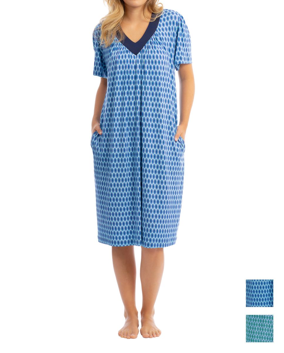 Woman with short-sleeved beach dress with blue oval print