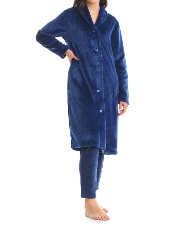 Woman in long buttoned blue vigore coat with dinner jacket collar
