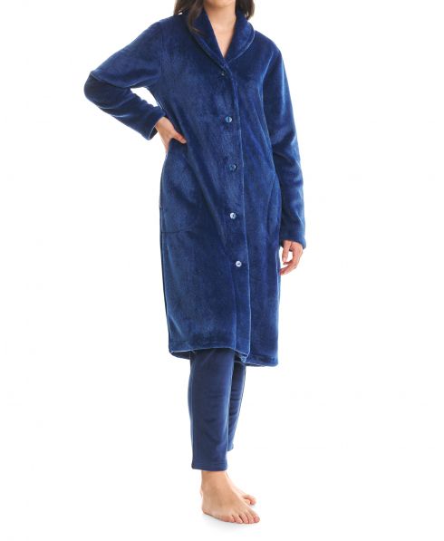 Woman in long buttoned blue vigore coat with dinner jacket collar