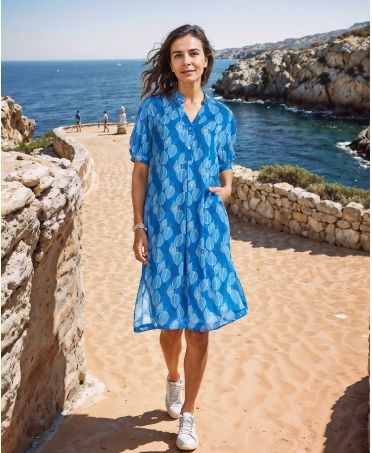 woman in a Short dress with buttoned collar and short sleeves for beach days in blue color