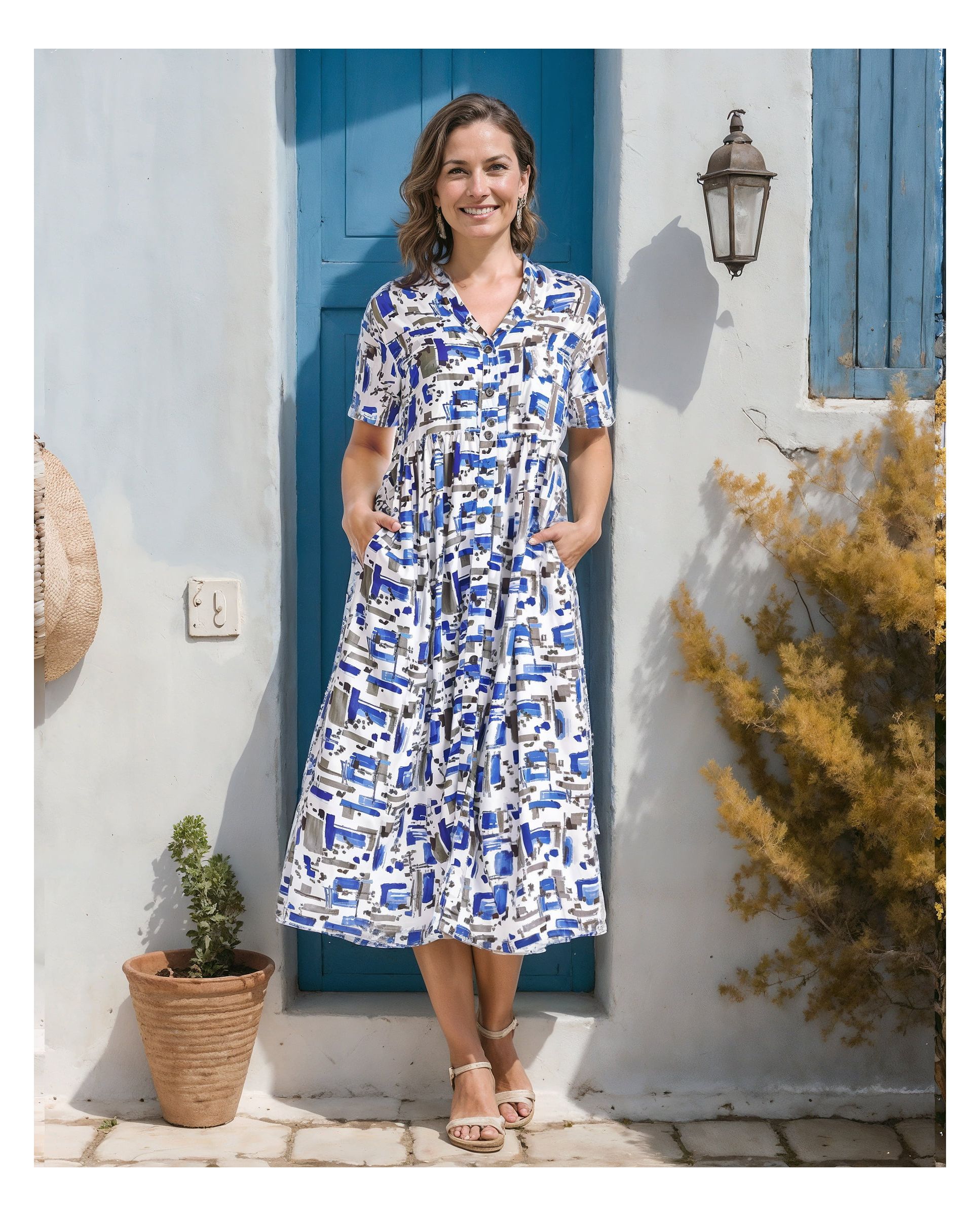 Woman in a Short sleeved open short sleeve dress with buttons and blue tones print