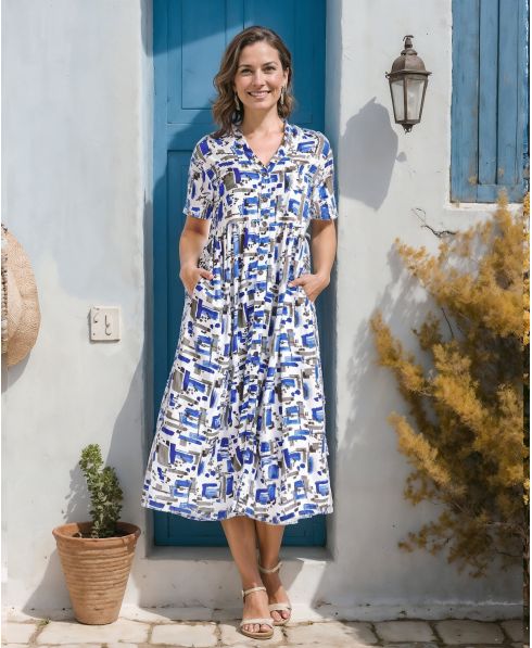 Woman in a Short sleeved open short sleeve dress with buttons and blue tones print